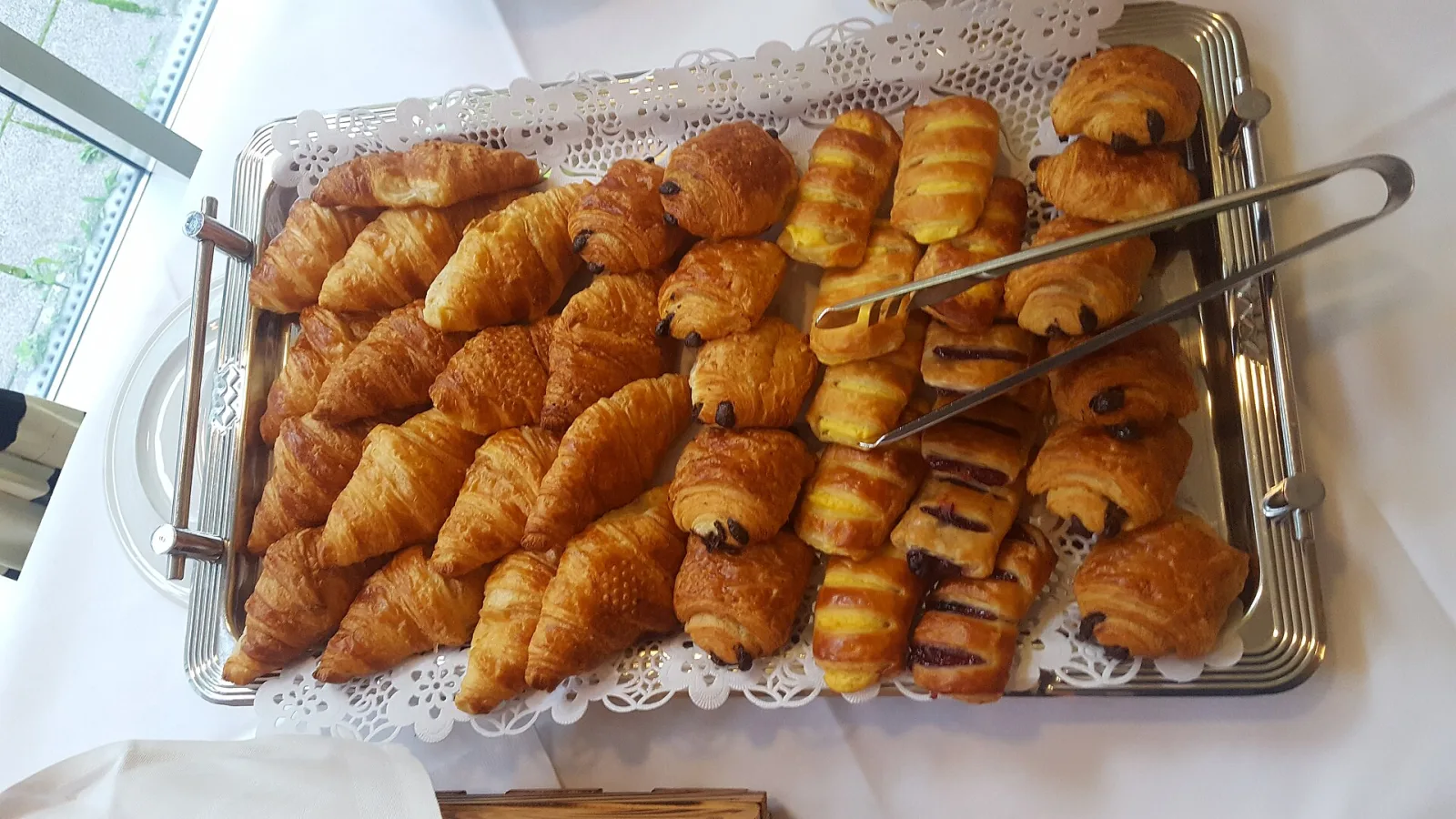 A tray of croissants and chocolate pastries. The photo was not taken at a Horizon West bakery.
