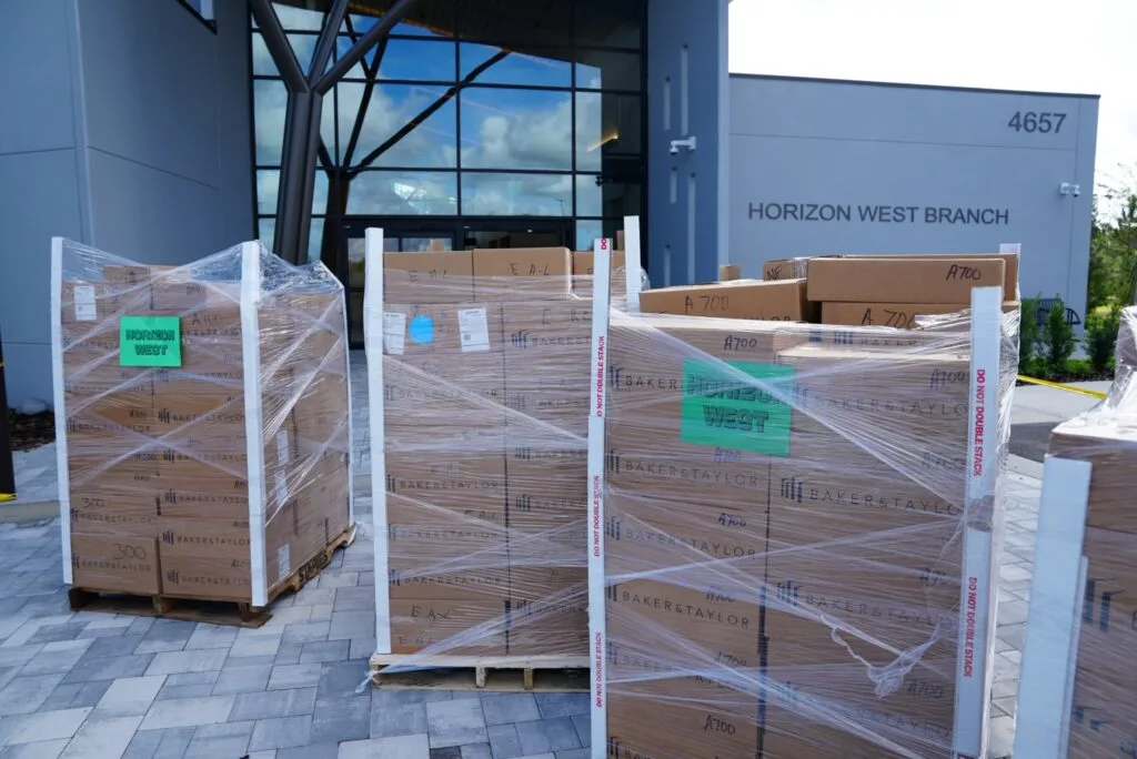 Pallets of books outside the Horizon West Branch at 4657 Hamlin Groves Trail, before staff shelved them.