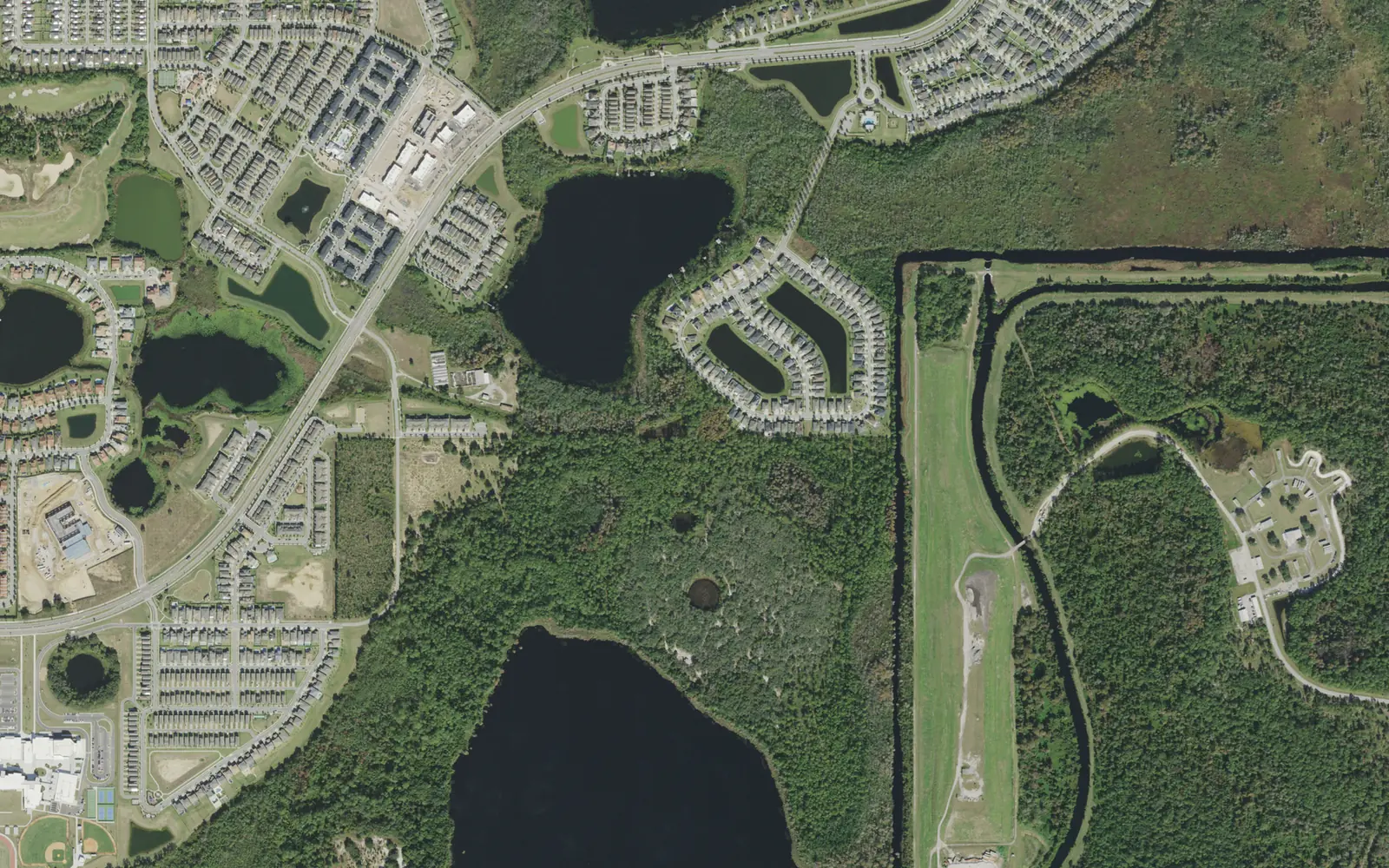 Aerial view of Village F, with Tub Lake at center, Reedy Lake below it and Horizon High School at the lower left edge