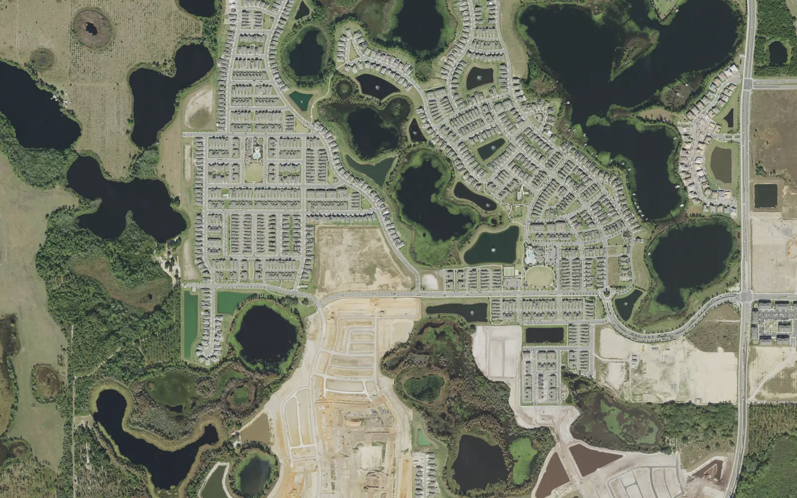 Aerial view of Village H around Lake Ihrig and Lake Heney, with new construction at the bottom