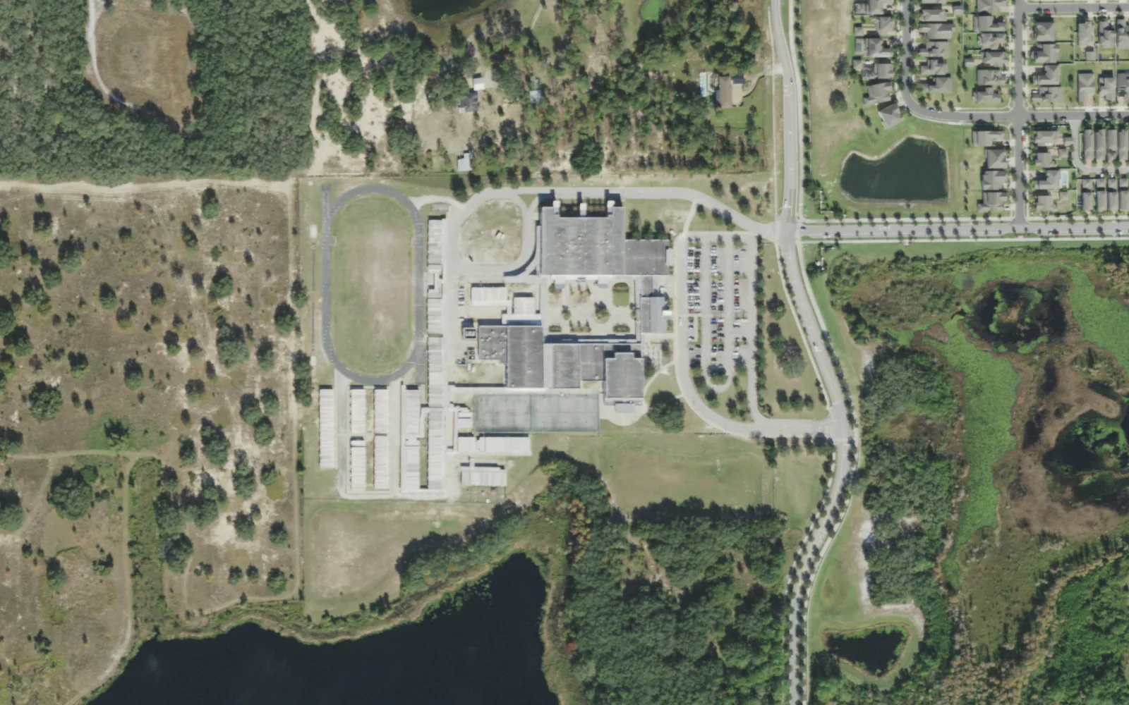 Bridgewater Middle School on Tiny Road in the Village of Bridgewater, seen from the air, with its track and fields to the west