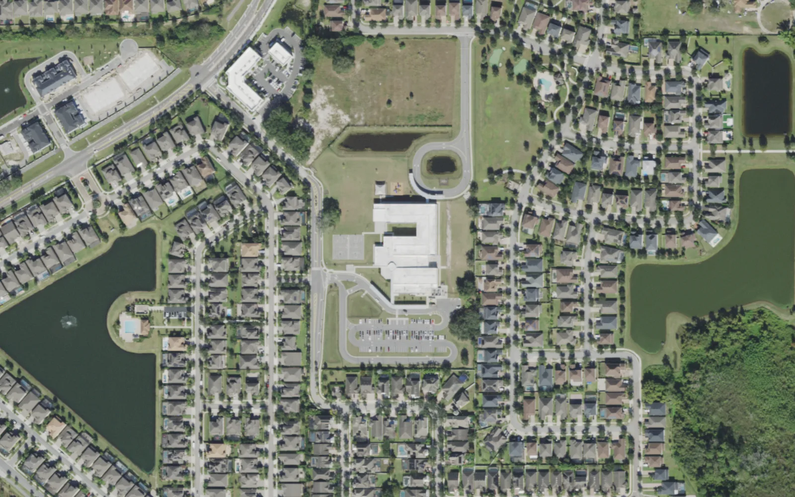 Castleview Elementary School on Taborfield Avenue, on the east edge of Horizon West, seen from the air, with ponds and homes around it