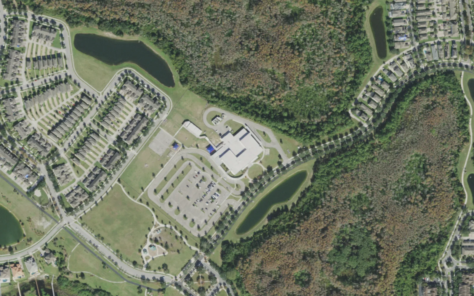 Independence Elementary School on New Independence Parkway, seen from the air, with woods to the east and homes to the west