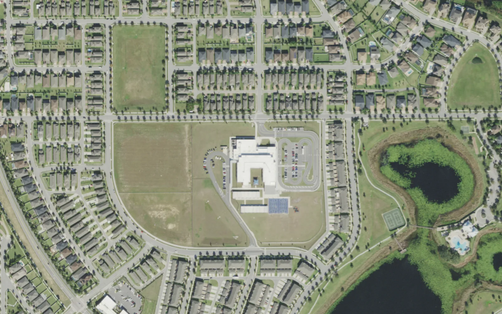 Summerlake Elementary School on Porter Road, seen from the air, with homes on three sides and a lake to the southeast