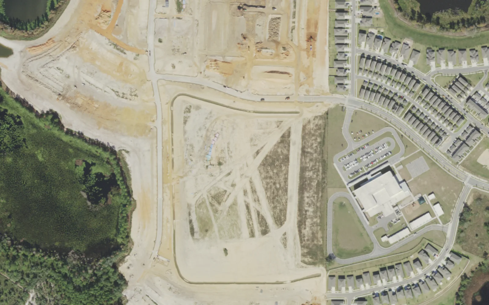 The Water Spring Middle School site being cleared in December 2021, seen from the air, with Water Spring Elementary at right