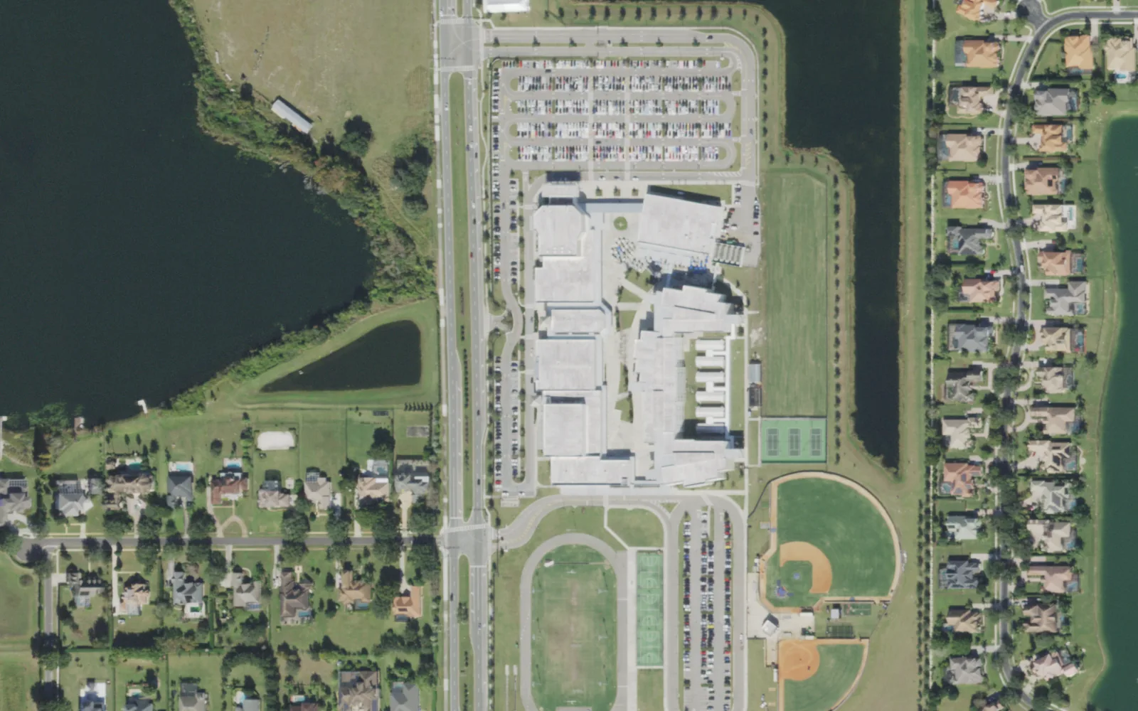Windermere High School on Winter Garden-Vineland Road, seen from the air, with its ball fields to the south and a lake to the west