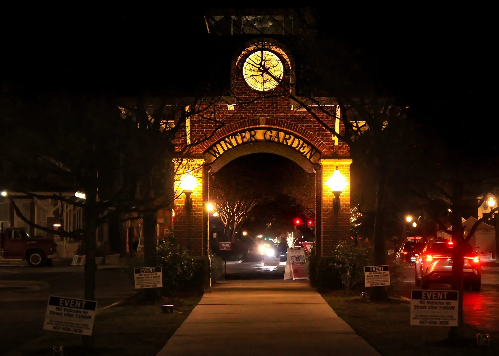 The clock tower arch over Plant Street in downtown Winter Garden at night, a few miles north of Horizon West