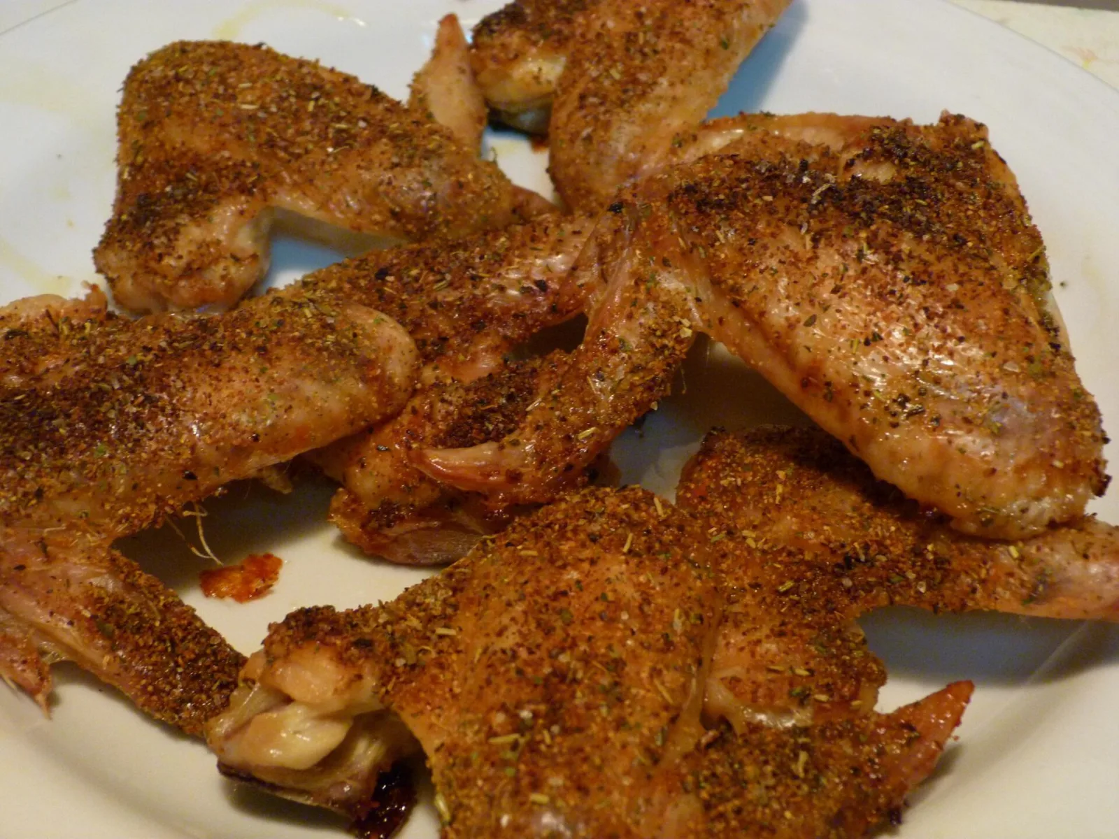 A plate of seasoned chicken wings. The photo was not taken at a Horizon West restaurant.